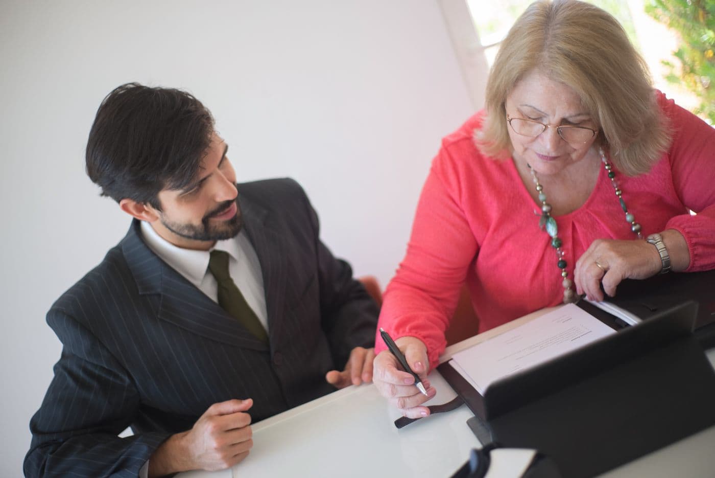 An estate attorney reviewing documents with a client